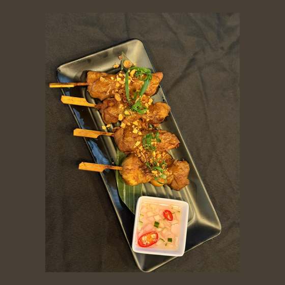 Golden Sukhothai chicken satay skewers with peanut sauce