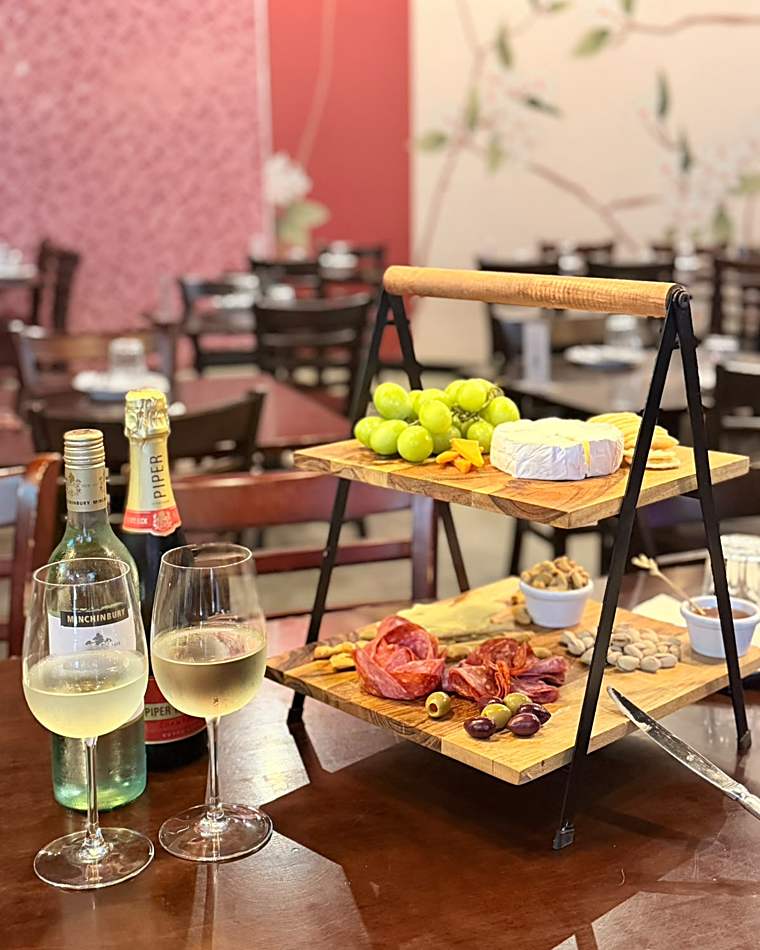 Cheese and charcuterie grazing board with wine